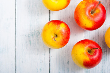 Wall Mural - apple fruits on old white wooden table