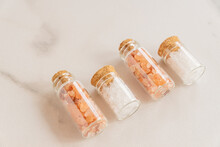 Close Up Pink And White Natural Himalayan Crystal Rock Mountain Organic Sea Salt In Grinder Bottle Glass On Whitw Marble Background