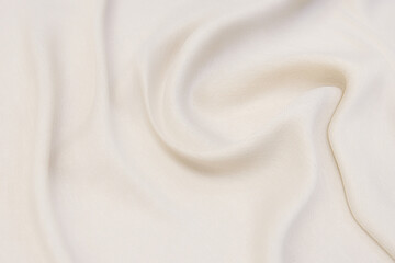 close-up texture of natural beige fabric or cloth in brown color. fabric texture of natural cotton o