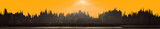Fototapeta Nowy Jork - extra wide panoramic silhouette of a huge futuristic city skyline and creative orange and red sunsets