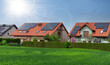 Row houses with solar panels, sunny sky. ECO Residential.