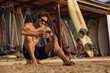 © Drobot Dean - Surfer using mobile phone on wooden platform