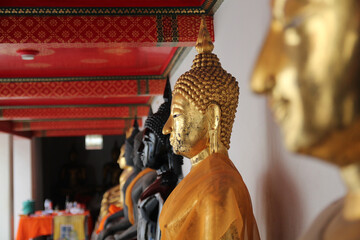 Sticker - Closeup of black and golden Buddha statues in Wat Pho, Thailand