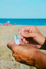 Wall Mural - man takes a covid-19 rapid test on the beach