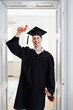 © diignat - Education, graduation and people concept - happy male student with diploma at home showing his emotions