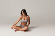 © master1305 - Young adorable woman in lingerie isolated over gray studio background. Natural beauty concept.