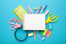 Blue School Supplies With Notebook On Blue Background. Back To School. Flat Lay.