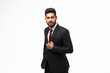 Handsome indian manager posing on white background.