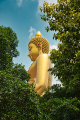 Giant golden buddha statue of Dhammakaya Thep Mongkol Buddha in construction site located at Wat Paknam Bhasicharoen temple