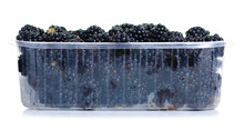 Plastic Container With Blackberries On White Background Isolation