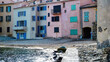 St. Tropez, France - June 9. 2016: View on small pebble beach in village center with colorful houses in summer