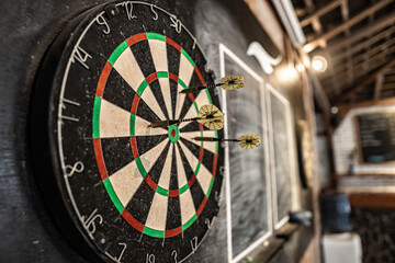 Poster - Closeup of dartboard with arrows on the target