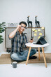 © Johnstocker - Young man working from home with digital tablet and smartphone