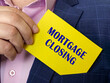 © Yurii Kibalnik - Business concept about MORTGAGE CLOSING with sign on the page.