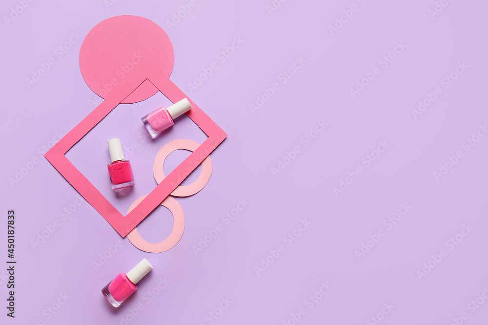 Bottles of bright nail polishes on color background