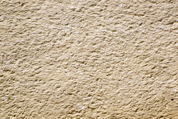 Canvas Print - Closeup shot of a dark beige textured wall