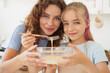 © fotofabrika - Mother and teen daughter making dough for pastry toghether in kitchen