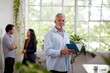 © Austockphoto - Professional businessman standing in an open studio office