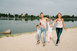© Serhii - Two mothers with kids walking on nature on summer day. Mom and son, daughter playing in the park. Concept of happy family. Close Up.