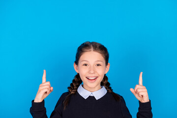 Sticker - Portrait of young smiling lovely schoolgirl advertising option offer sale discount black friday isolated on blue color background