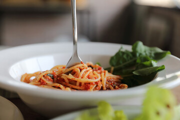 Wall Mural - spaghetti Bolognese with italian sausage and tomato sauce with parmesan cheese and basil