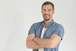© aletia2011 - Handsome young man with arms crossed posing in studio