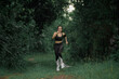 © Chanwit - Young people trail running Exercising on forest path. Healthy, fitness, wellness lifestyle. Sport, cardio, workout concept