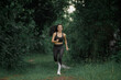 © Chanwit - Young people trail running Exercising on forest path. Healthy, fitness, wellness lifestyle. Sport, cardio, workout concept