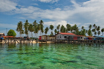 Wall Mural - Island of Borneo. Malaysia. November 30, 2018. Sea Gypsy village on a sandy coral reef island. The main trade of local residents is fishing and sea Souvenirs.