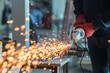 Worker working with a circular grinder on a metal with sparks flying out of them, selective focus
