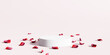 Cosmetic product display podium with red rose petals on pink background. 3D rendering