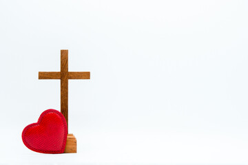 Wall Mural - Wood crucifix and red heart on white background. Concept of hope, faith, love, symbol christianity, religion, church online, Easter time, God loves world, Jesus loves you, background with Copy Space