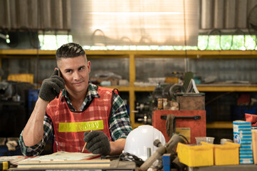 Caucasian industrial engineer worker using mobile phone