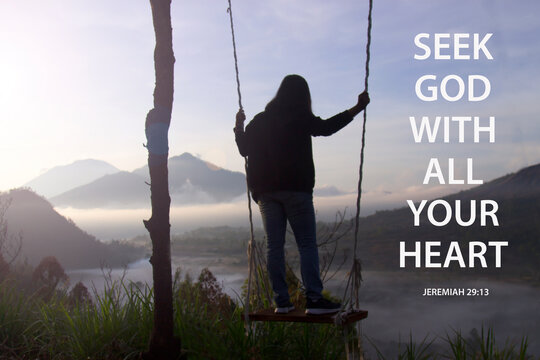 Wall Mural -  - Bible verse quote - Seek God with all your heart. Jeremiah 29:13 With woman standing on natural wooden swing with misty morning view in the mountain. Christianity concept.