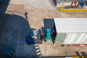 Oil barrels forklift truck move for on the transportation truck