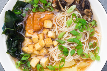 vegan ramen soup with mushrooms, tofu and vegetables