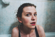 Close-up Portrait Of Woman In Bathroom