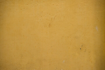 Yellow texture on the wall of a house. Pelourinho, Salvador, Bahia, Brazil.