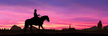 Cowboy On A Horse At Sunset