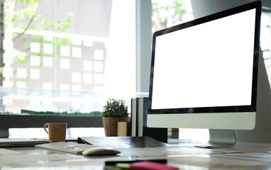 Wall Mural - Mock up computer with blank screen on white table.