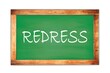 REDRESS text written on green school board.