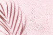 © uv_group - Water background. Pink aqua texture, surface of ripples, transparent palm leaf shadows and sunlight. Spa concept background. Flat lay, top view, copy space, banner