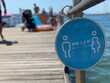 COVID 19, signage with a minimum distance between men and women 1.5 meters on a dock, Slovenia 