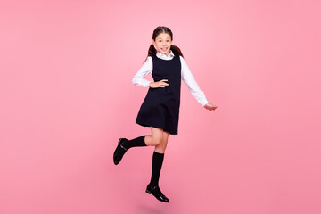 Sticker - Full length body size photo schoolgirl jumping up wearing uniform confident isolated pastel pink color background