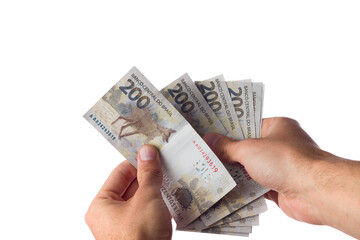 man holding 200 reais bills isolated on white. Brazilian money. paying