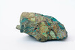 copper ore from a copper mine in Chile, a green stone on a white background.