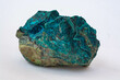 copper ore from a copper mine in Chile, a green stone on a white background.