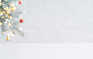 Wall Mural - white table in against of blurred branch of christmas tree with bauble
