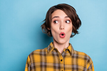 Poster - Photo of amazed funky girl open mouth look empty space wear checkered shirt isolated blue color background