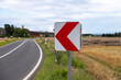© Stockhausen - arrow sign in a curve of a country road